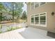 Enjoy outdoor living on this spacious back deck with white railings, perfect for relaxing and entertaining with serene backyard views at 3440 Canyon Oak Way, Cumming, GA 30041