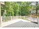 Spacious back deck surrounded by mature trees, perfect for outdoor entertaining at 3440 Canyon Oak Way, Cumming, GA 30041