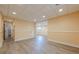 Finished basement area with recessed lighting, neutral walls, and vinyl flooring, perfect for flexible living space at 3440 Canyon Oak Way, Cumming, GA 30041