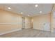 Bright basement featuring recessed lights, painted walls, and durable flooring, creating an adaptable living area at 3440 Canyon Oak Way, Cumming, GA 30041