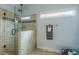 Modern bathroom with a glass-enclosed shower featuring decorative tile accents and natural light from a window at 3440 Canyon Oak Way, Cumming, GA 30041