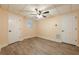 Cozy bedroom with a ceiling fan, two doors, and natural light, creating a relaxing space at 3440 Canyon Oak Way, Cumming, GA 30041