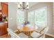 Cozy breakfast nook with natural light shining through shuttered windows at 3440 Canyon Oak Way, Cumming, GA 30041