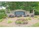 Stone entrance sign for Northern Oaks community with colorful flower bed at 3440 Canyon Oak Way, Cumming, GA 30041