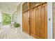 Inviting front porch with double wood front doors, a seating area, and charming accents at 3440 Canyon Oak Way, Cumming, GA 30041