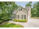 Two-story traditional home with attached garage and well manicured landscaping at 3440 Canyon Oak Way, Cumming, GA 30041