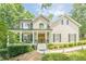 Charming home with a welcoming front porch and beautifully landscaped front yard at 3440 Canyon Oak Way, Cumming, GA 30041