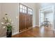 Grand foyer featuring double doors, hardwood floors, and views into the adjacent living spaces at 3440 Canyon Oak Way, Cumming, GA 30041