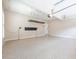 Large garage with a durable floor and overhead lighting, offering ample space for parking and storage at 3440 Canyon Oak Way, Cumming, GA 30041