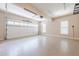 Spacious two-car garage with epoxy flooring and bright lighting, perfect for storage and vehicles at 3440 Canyon Oak Way, Cumming, GA 30041