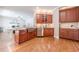 Open kitchen with stainless steel appliances, granite countertops, and custom wood cabinetry at 3440 Canyon Oak Way, Cumming, GA 30041