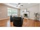 Bright living room with a fireplace, hardwood floors, and plenty of natural light at 3440 Canyon Oak Way, Cumming, GA 30041