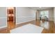 Inviting living area with hardwood floors and neutral tones flowing into the kitchen at 3440 Canyon Oak Way, Cumming, GA 30041