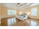 Spacious main bedroom with a trey ceiling, large windows, and hardwood floors at 3440 Canyon Oak Way, Cumming, GA 30041