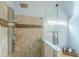 Modern shower with tile surround, glass enclosure, and a rainfall shower head at 3440 Canyon Oak Way, Cumming, GA 30041