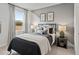 Charming bedroom with modern lamps, contemporary wall art, and window with natural light at 92 Sheryl Way, Loganville, GA 30052