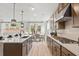 Open kitchen featuring a center island, stainless steel appliances, and easy access to living areas at 92 Sheryl Way, Loganville, GA 30052