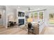 Open Living room with fireplace and large window with backyard views at 92 Sheryl Way, Loganville, GA 30052