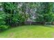 Mature tree lined back yard at 1214 Tyne Way, Stone Mountain, GA 30088