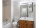 Bathroom features a tub and shower combination, and a vanity sink at 1214 Tyne Way, Stone Mountain, GA 30088