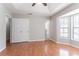 Bright bedroom features a trey ceiling, wood floors, and a sunny bay window at 1214 Tyne Way, Stone Mountain, GA 30088