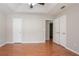 Spacious bedroom with wood-look flooring, gray walls, and an expansive closet at 1214 Tyne Way, Stone Mountain, GA 30088