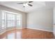 Spacious bedroom featuring hardwood floors and a bay window at 1214 Tyne Way, Stone Mountain, GA 30088