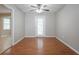 Bright dining area features wood floors, ceiling fan, and door to the exterior at 1214 Tyne Way, Stone Mountain, GA 30088