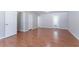 Living room with wood-look flooring and a sliding door to the backyard at 1214 Tyne Way, Stone Mountain, GA 30088
