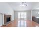 Bright living room with a fireplace, bay window, and hardwood floors at 1214 Tyne Way, Stone Mountain, GA 30088