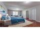 Main bedroom features a plush bed, sitting area, and spacious closet at 1214 Tyne Way, Stone Mountain, GA 30088