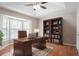 Office with hardwood floors, bay window, and built-in bookcase at 1214 Tyne Way, Stone Mountain, GA 30088