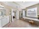 Bright bathroom features double vanity, walk-in shower and a soaking tub at 1251 Irwin Lake Way, Marietta, GA 30064