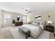 Bright bedroom features a ceiling fan, neutral walls, and stylish decor at 1251 Irwin Lake Way, Marietta, GA 30064