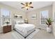 Comfortable bedroom with light walls, a ceiling fan, and bright windows at 1251 Irwin Lake Way, Marietta, GA 30064