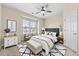 Inviting bedroom featuring a tufted headboard, accent chairs, and stylish black and white rug at 1251 Irwin Lake Way, Marietta, GA 30064