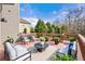 Back deck featuring cushioned seating, potted plants, and scenic views at 1251 Irwin Lake Way, Marietta, GA 30064