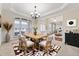 Elegant dining room with classic chandelier and large window at 1251 Irwin Lake Way, Marietta, GA 30064