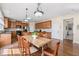 Charming kitchen with natural wood cabinets, and an adjacent breakfast nook at 1251 Irwin Lake Way, Marietta, GA 30064