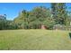 Large backyard with a shed and plenty of trees that offer shade from the sun at 2055 Anderson Se Dr, Smyrna, GA 30080