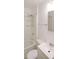 Bright bathroom with a shower and tub, a sink, a toilet, and a mirror at 2055 Anderson Se Dr, Smyrna, GA 30080
