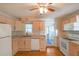 Bright kitchen features white appliances, ample counter space, and light wood cabinetry at 2055 Anderson Se Dr, Smyrna, GA 30080
