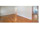 Open-concept living space featuring beautiful hardwood floors and neutral wall color at 2055 Anderson Se Dr, Smyrna, GA 30080