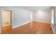 Inviting living room features gleaming hardwood floors with access to the bathroom at 2055 Anderson Se Dr, Smyrna, GA 30080