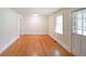 Bright living room with gleaming hardwood floors and fresh, neutral paint at 2055 Anderson Se Dr, Smyrna, GA 30080