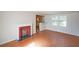 Cozy living room features a fireplace and adjoins the kitchen at 2055 Anderson Se Dr, Smyrna, GA 30080