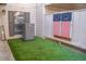 Inviting outdoor space featuring artificial turf and a custom cornhole game at 4846 Twin Lakes Trl, Atlanta, GA 30360