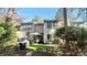 Backyard view that features synthetic grass, patio furniture, mature trees, and string lights at 4846 Twin Lakes Trl, Atlanta, GA 30360
