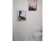 Bright bathroom with decorative artwork, a modern toilet, and fresh white walls offer a clean and stylish aesthetic at 4846 Twin Lakes Trl, Atlanta, GA 30360