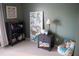 Playful bedroom featuring a comfortable beanbag chair, bookcase, dinosaur poster, and a green color scheme at 4846 Twin Lakes Trl, Atlanta, GA 30360
